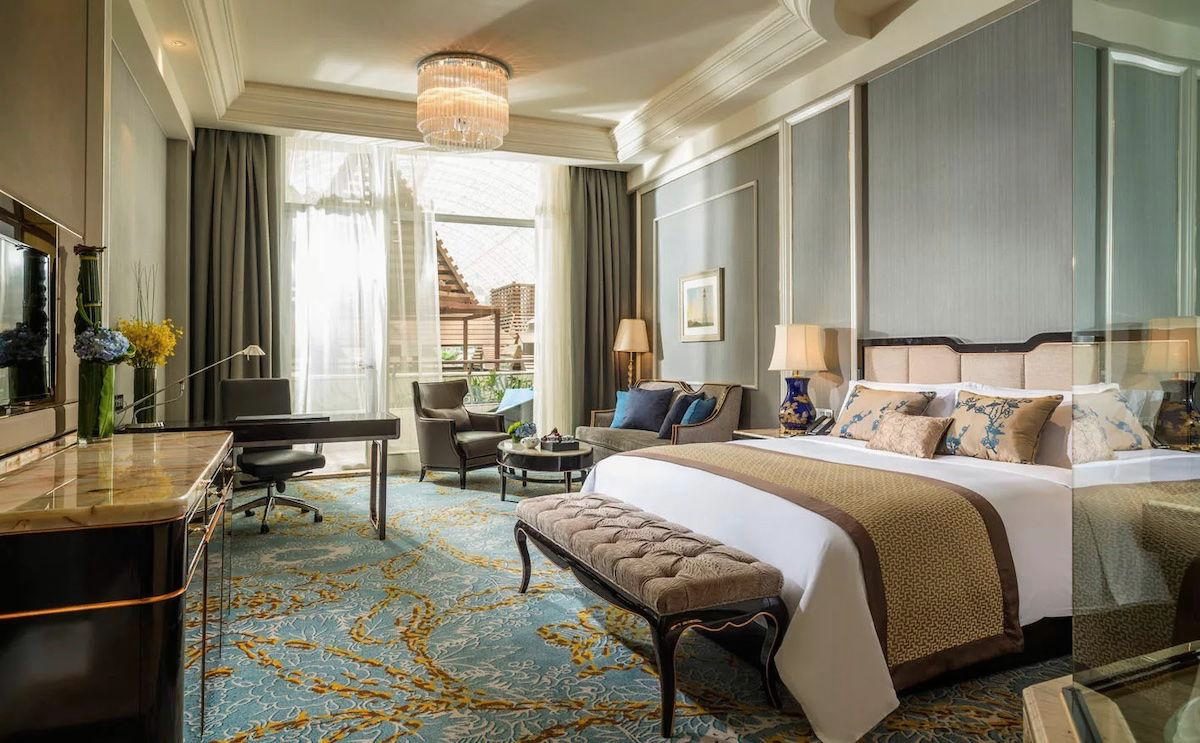 Executive Suite with a king bed, a writing desk, lounge seating and a terrace view
